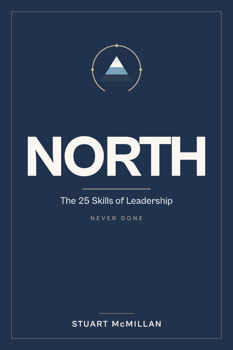 Cover of NORTH: The 25 Skills of Leadership by Stuart McMillan. A navy field guide with a compass-and-peak mark.
